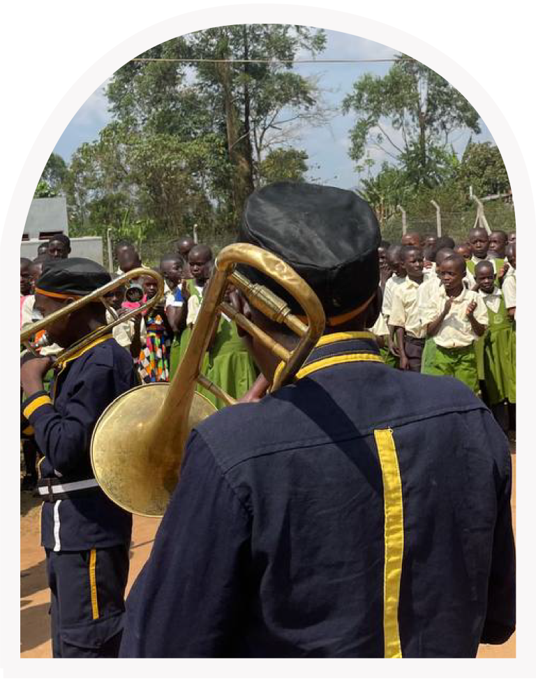 The Maisha Brass Band performing for students